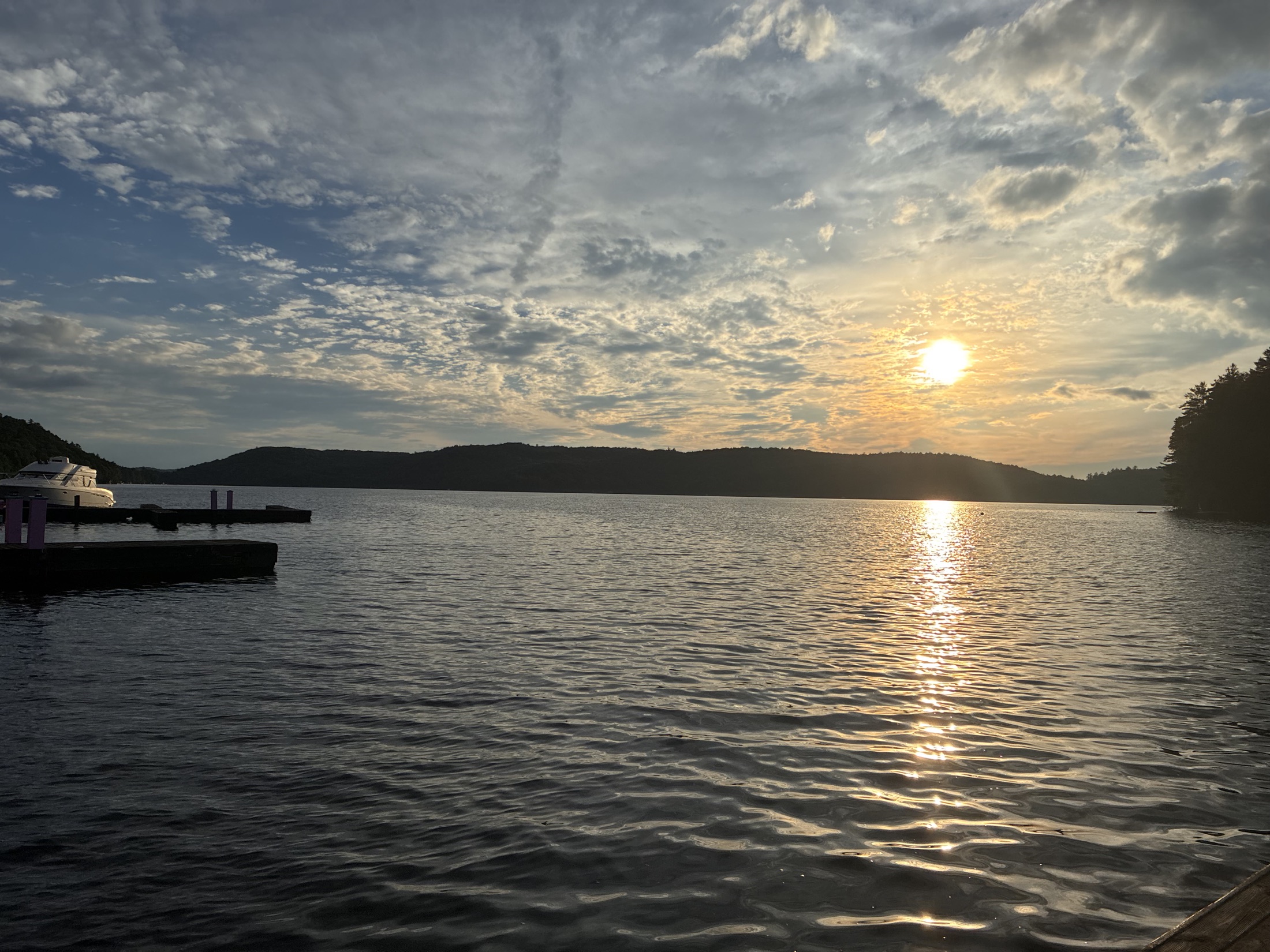 Sunset over a calm lake from the dock